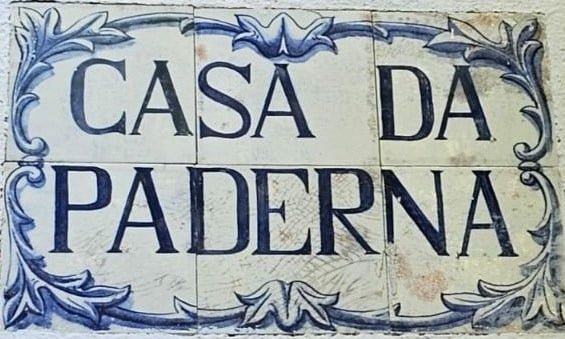 The hand-painted blue-and-white azulejo panel beside the front door, lettered &ldquo;Casa da Paderna&rdquo;.